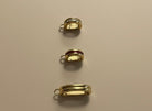 Three bikini clip on a beige background